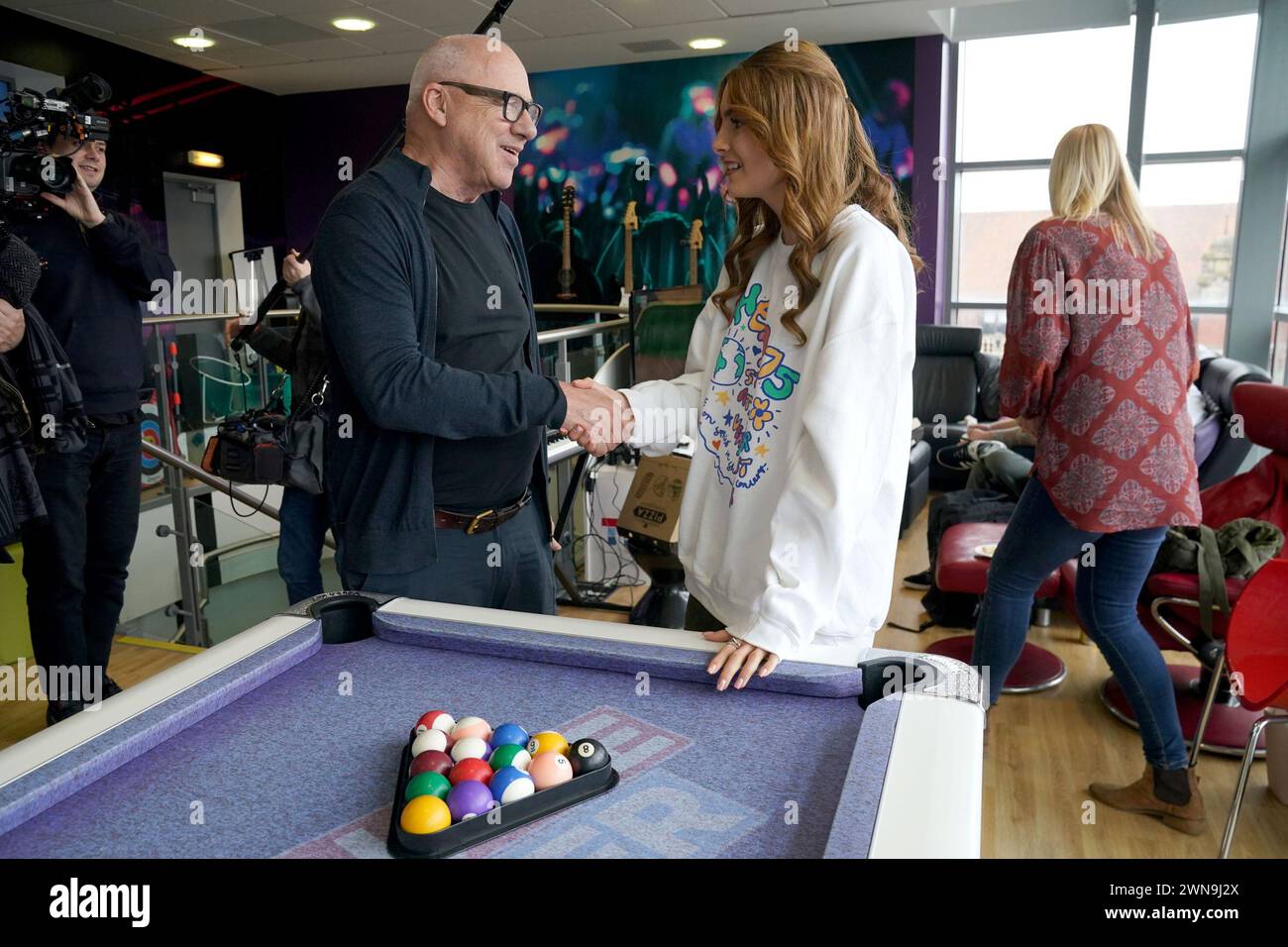 Dire Straits star Mark Knopfler meets Lauren Taylor, 18, from Middlesbrough, who was diagnosed with cancer at 15, during a visit to the Teenage Cancer Trust ward, at the Royal Victoria Infirmary, Newcastle. Picture date: Friday March 1, 2024. Stock Photo