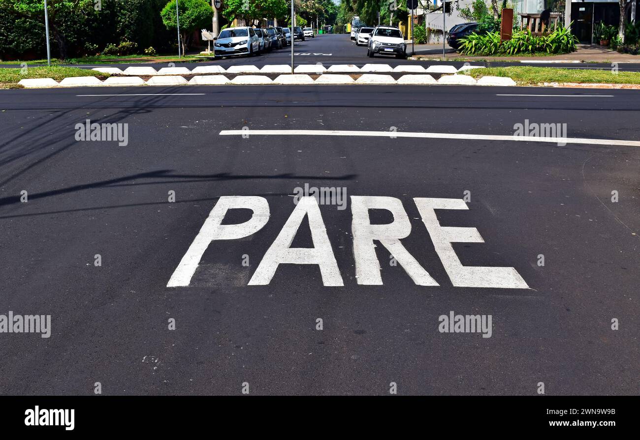 Street sign on asphalt indicating STOP, Ribeirao Preto, Sao Paulo, Brazil Stock Photo