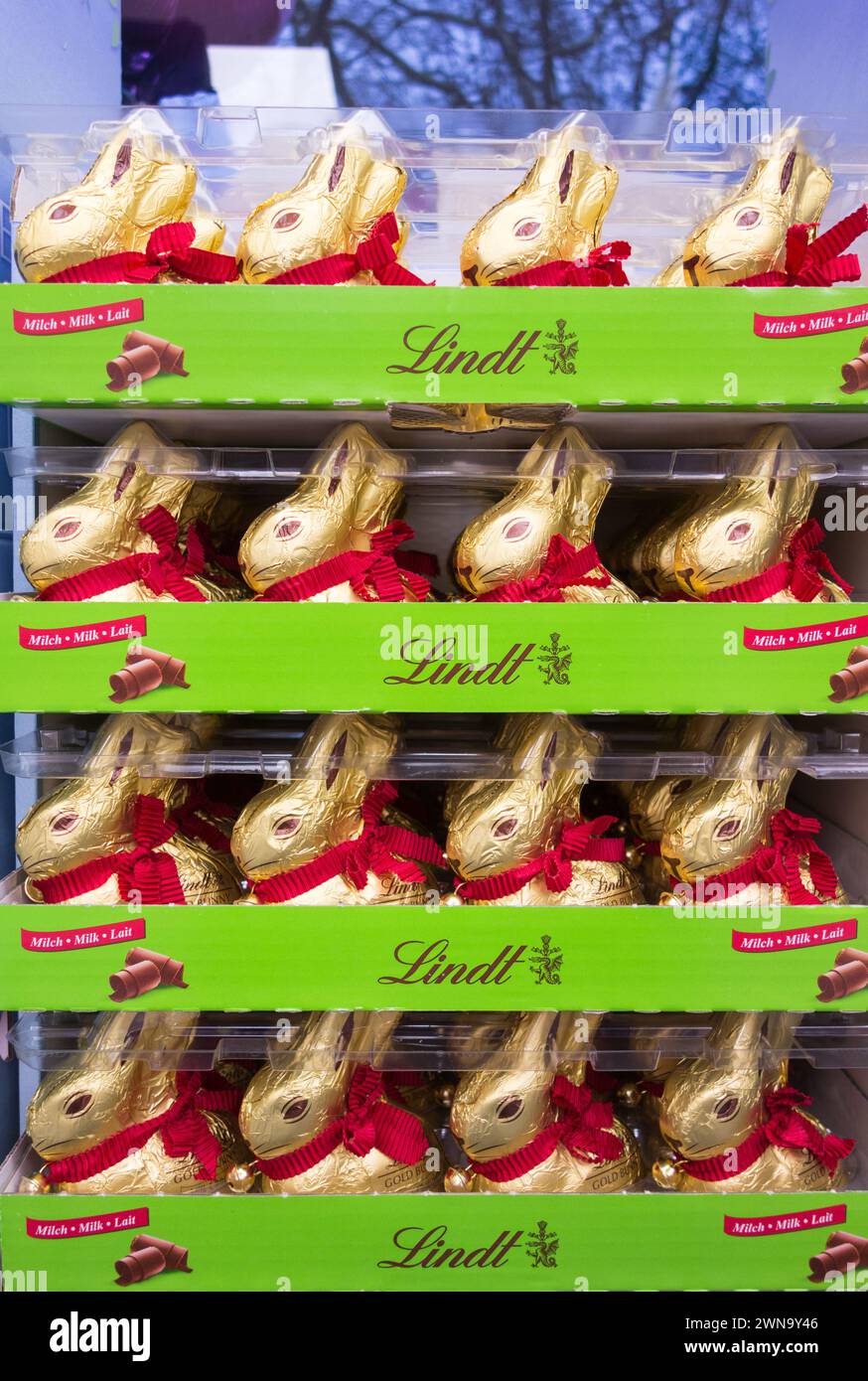 Close up of attractive Lindt Golden Milk Easter Chocolate bunnies on a shelf in a shop in the UK Stock Photo