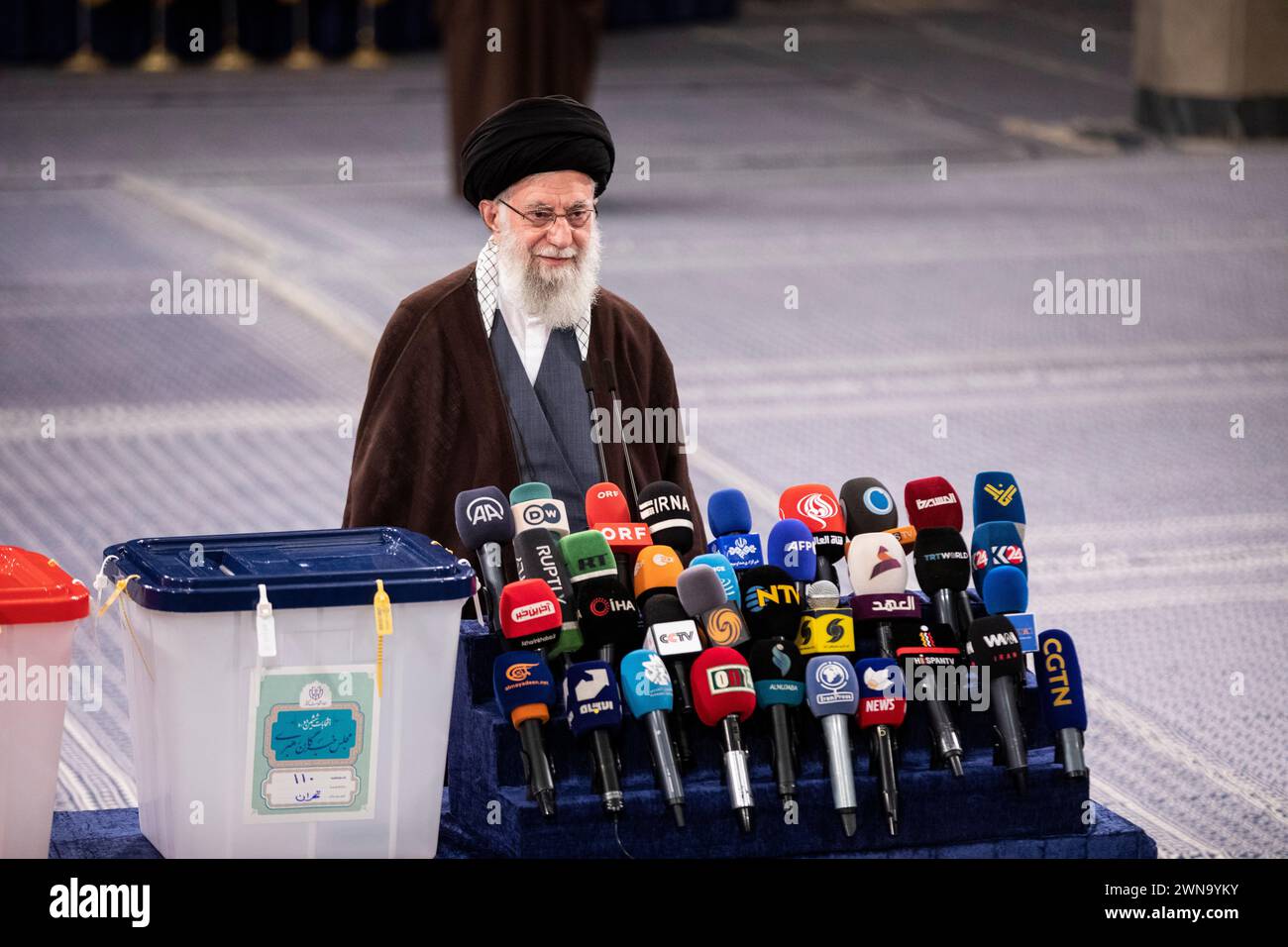 Iran's supreme leader Ayatollah Khamenei speaks to journalists after casting his vote on 01