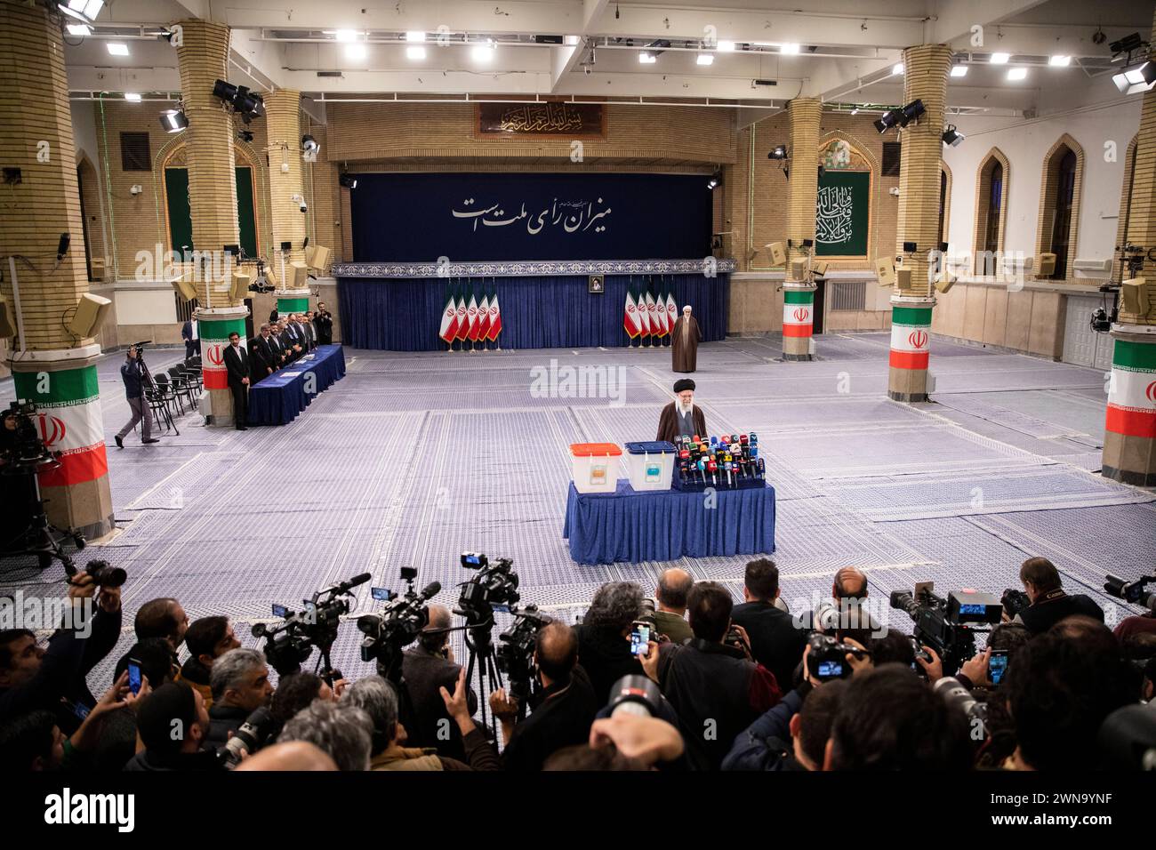 Iran's supreme leader Ayatollah Khamenei speaks to journalists after casting his vote on 01