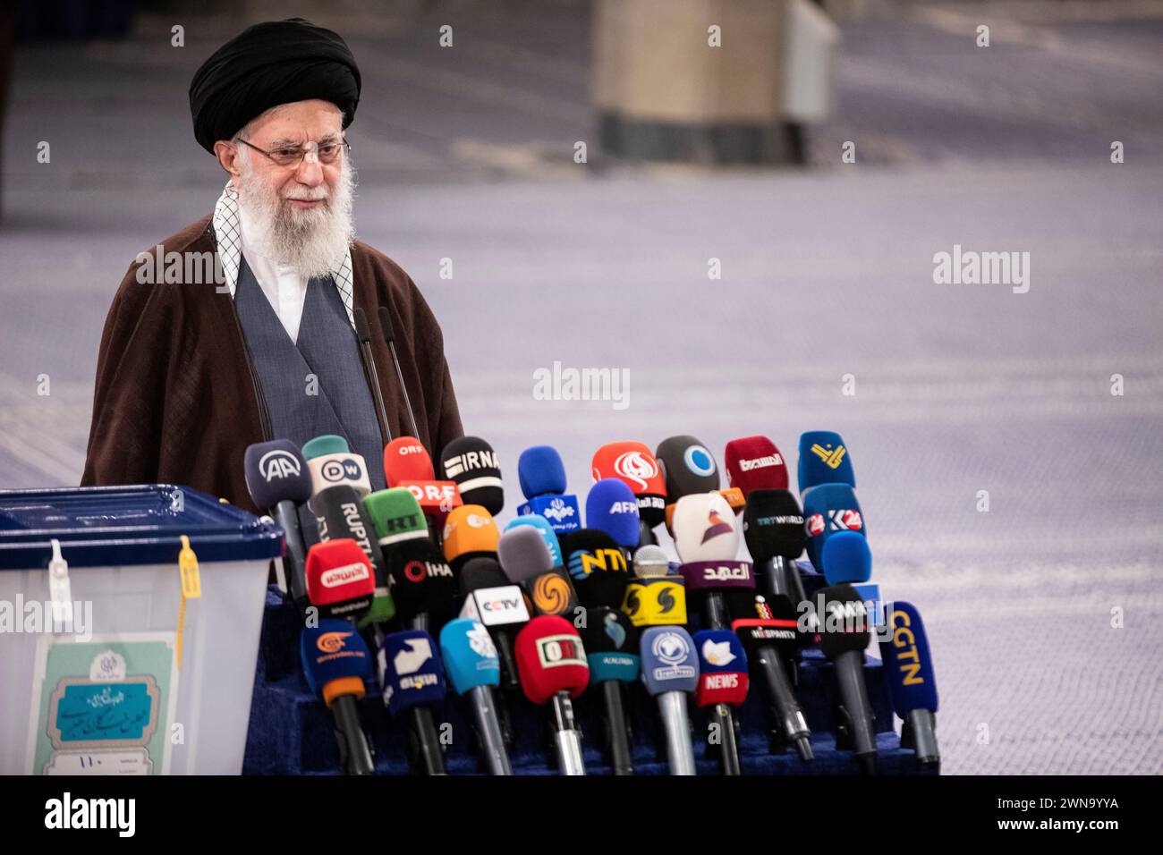 Iran's supreme leader Ayatollah Khamenei speaks to journalists after casting his vote on 01
