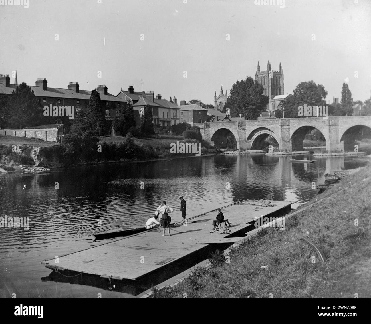 1897 Historic Black and White Photograph of  a Landing Stage on the the River Wye with Wye Bridge and Cathedral, Hereford, Herefordshire, England, UK Stock Photo