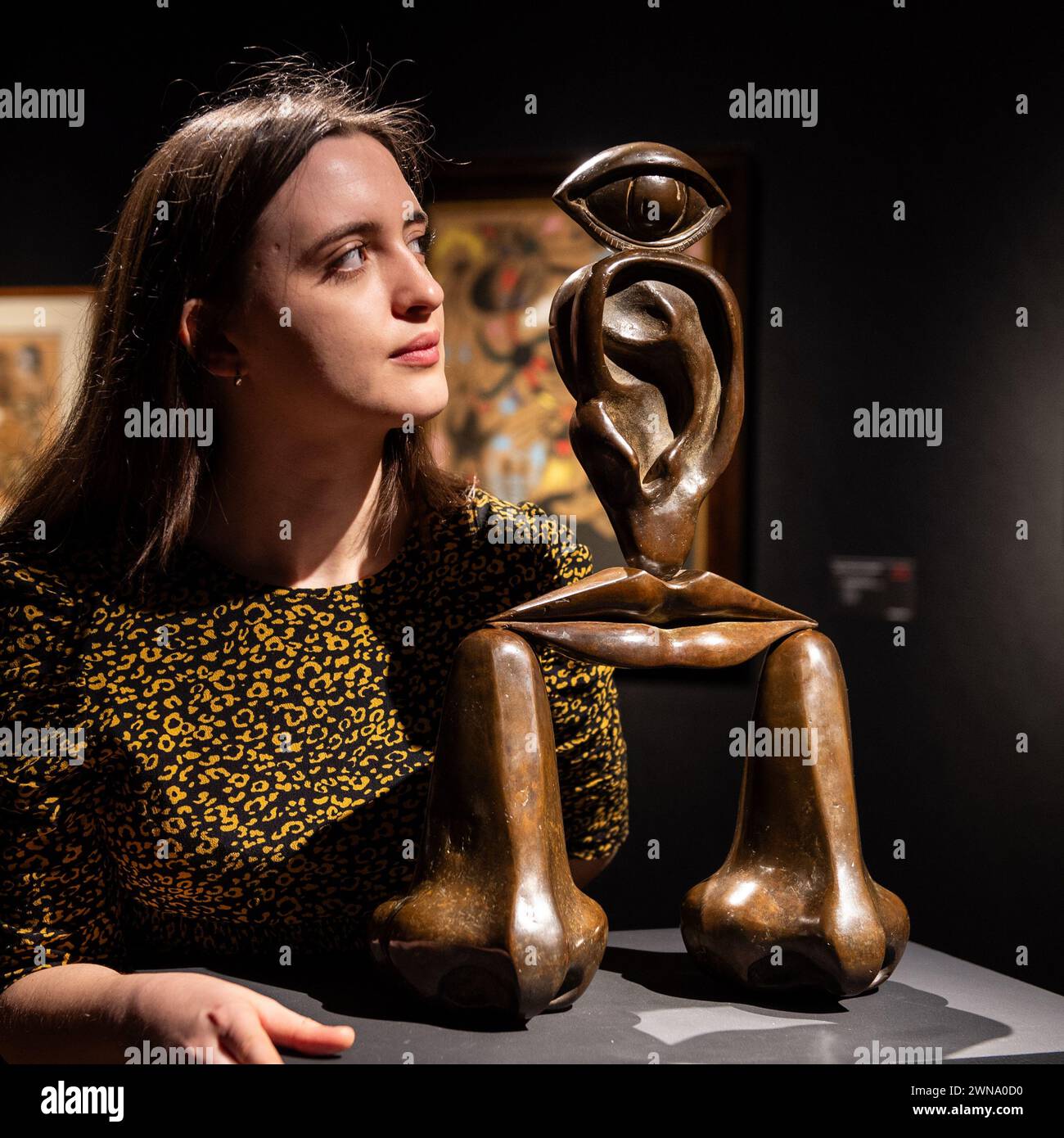 London, England, UK. 1st Mar, 2024. Christie's staff member looks at Rene Magritte's ''La race blanche, '' estimated at GBP 300,000 - 500,000, during the press preview of Christie's '20th/21st Century London Evening Sale' and 'The Art of The Surreal Evening Sale'. The sales will take place on the evening of March 7. (Credit Image: © Thomas Krych/ZUMA Press Wire) EDITORIAL USAGE ONLY! Not for Commercial USAGE! Stock Photo