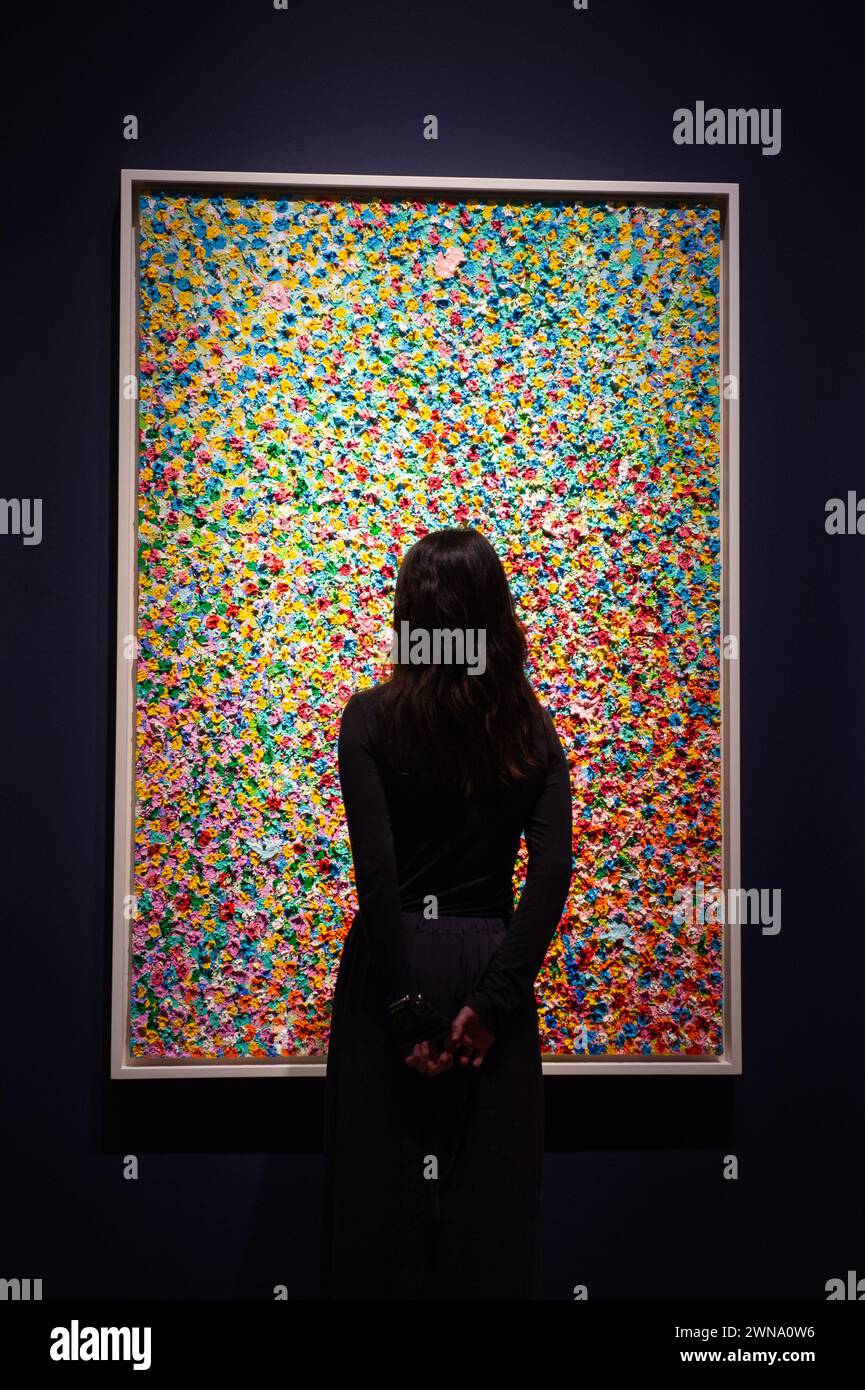 London, England, UK. 1st Mar, 2024. Christie's staff member looks at Damien Hirst's ''Veil of Serendipity'' estimated at GBP 650,000 - 850,000, during the press preview of Christie's '20th/21st Century London Evening Sale' and 'The Art of The Surreal Evening Sale'. The sales will take place on the evening of March 7. (Credit Image: © Thomas Krych/ZUMA Press Wire) EDITORIAL USAGE ONLY! Not for Commercial USAGE! Stock Photo