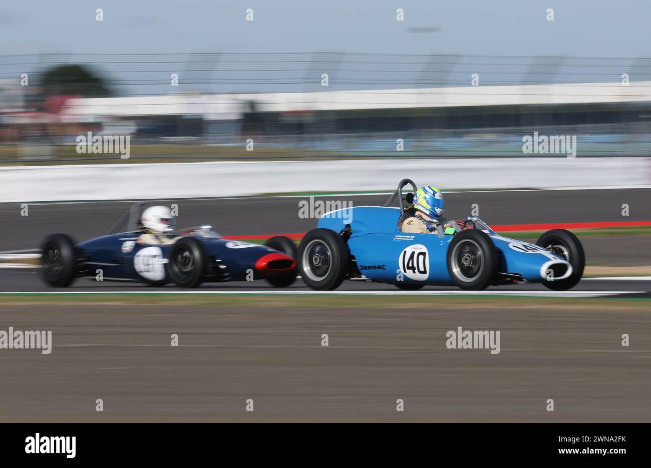 19/07/22  Competitors at The Classic drive a selection of some of the most precious and iconic racing, sports and F1 cars from history around Silverst Stock Photo