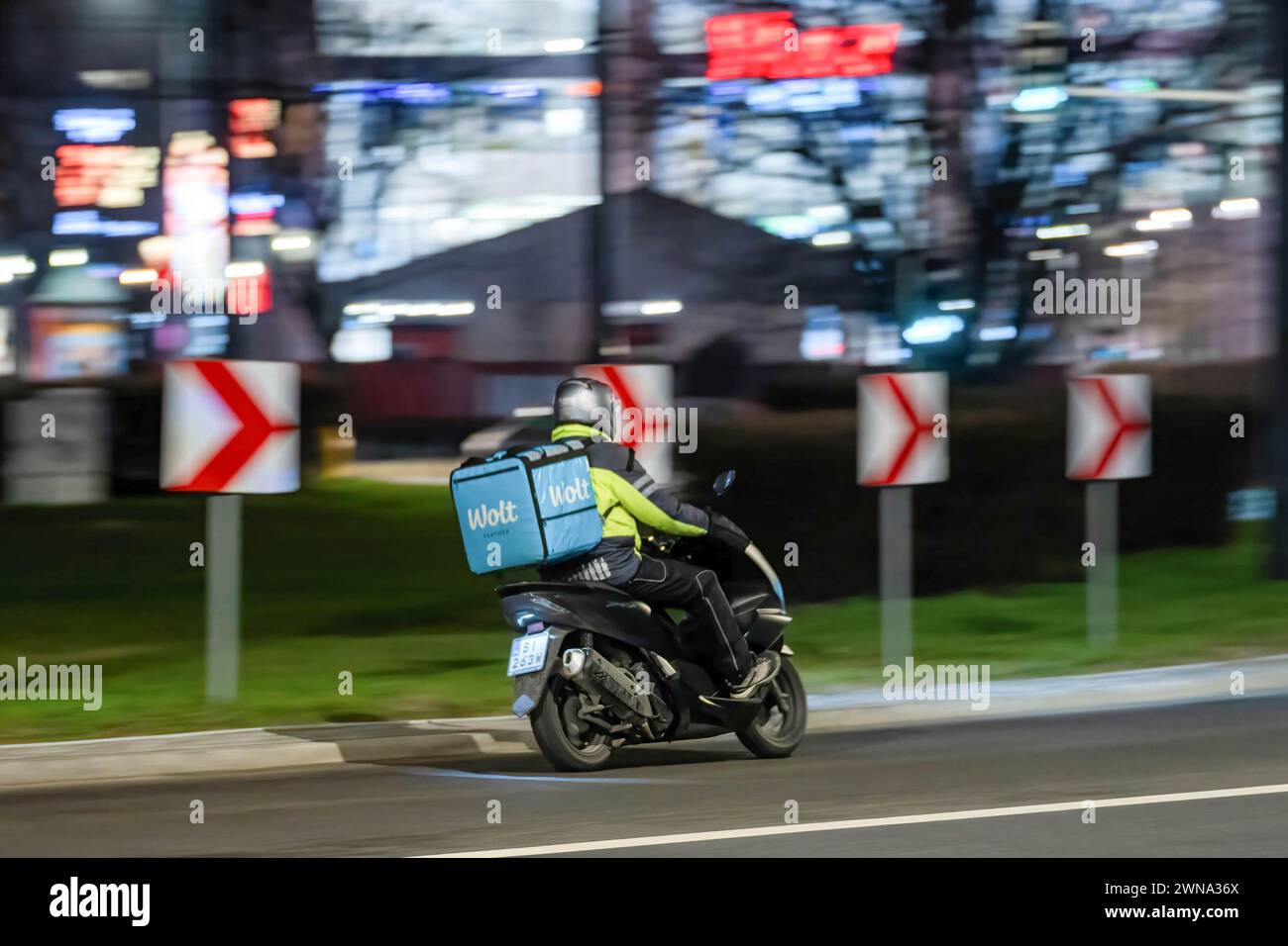 Wolt delivery rider seen riding on the street in Warsaw. Stock Photo