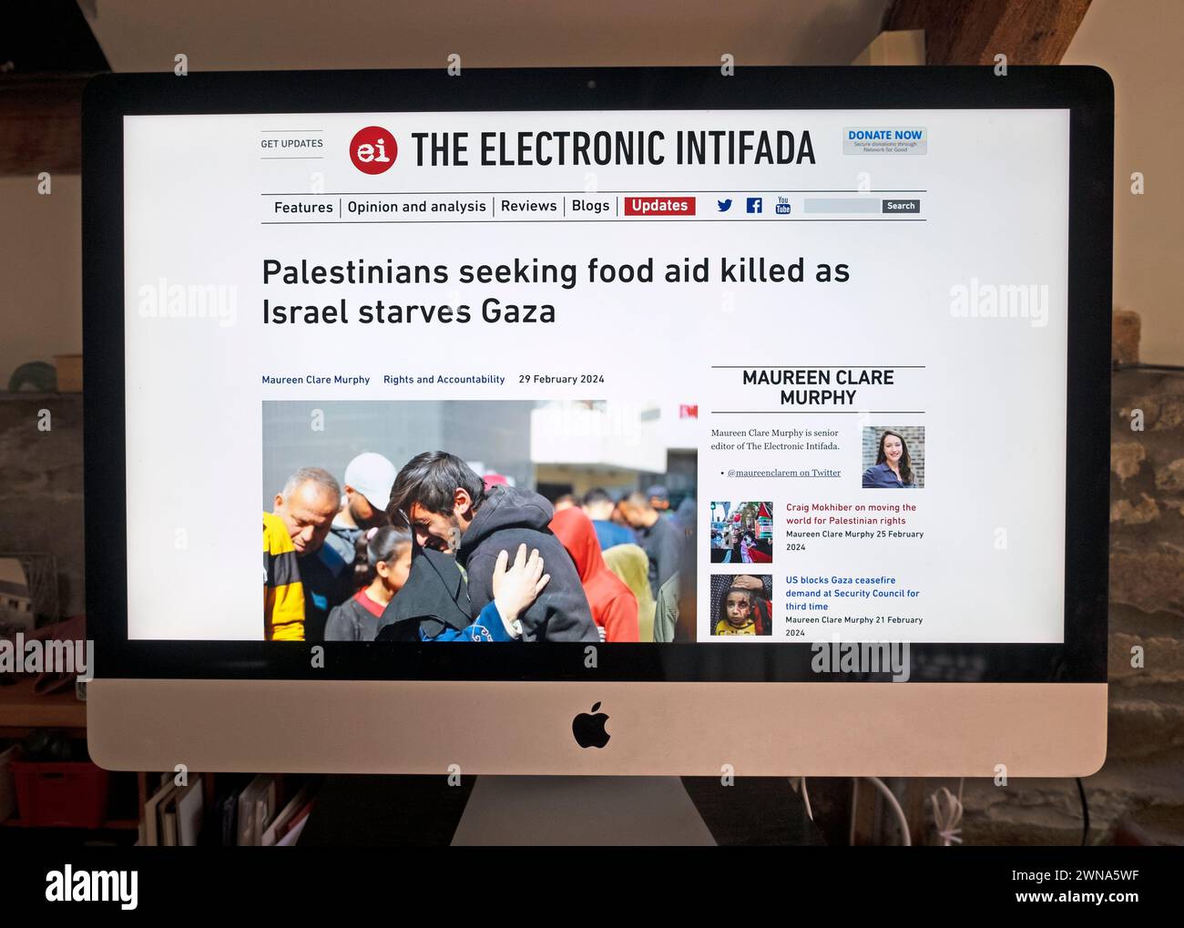 'Palestinians seeking food aid killed as Israel starves Gaza' screenshot of The Electronic Intifada online website home computer 29 February 2024 UK Stock Photo