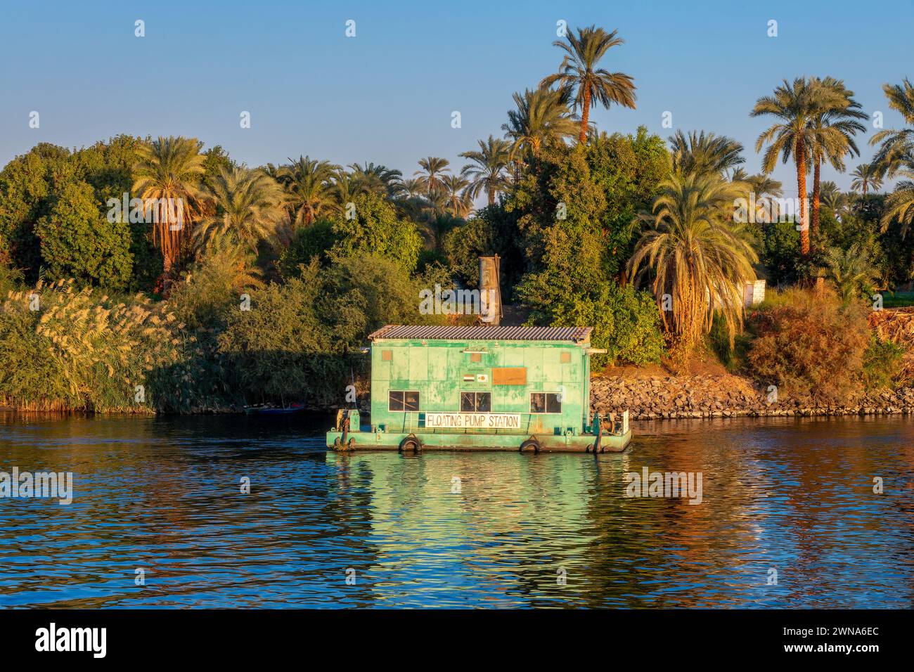 Floating pump station, water pumping for irrigation on the Nile river, Egypt Stock Photo