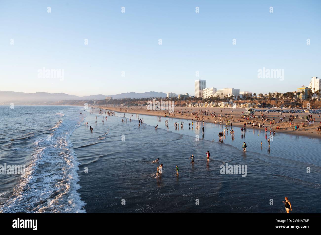 SANTA MONICA, CALIFORNIA, USA: People flock to the beach next to the world famous Santa Monica Pier in Santa Monica, California. Stock Photo