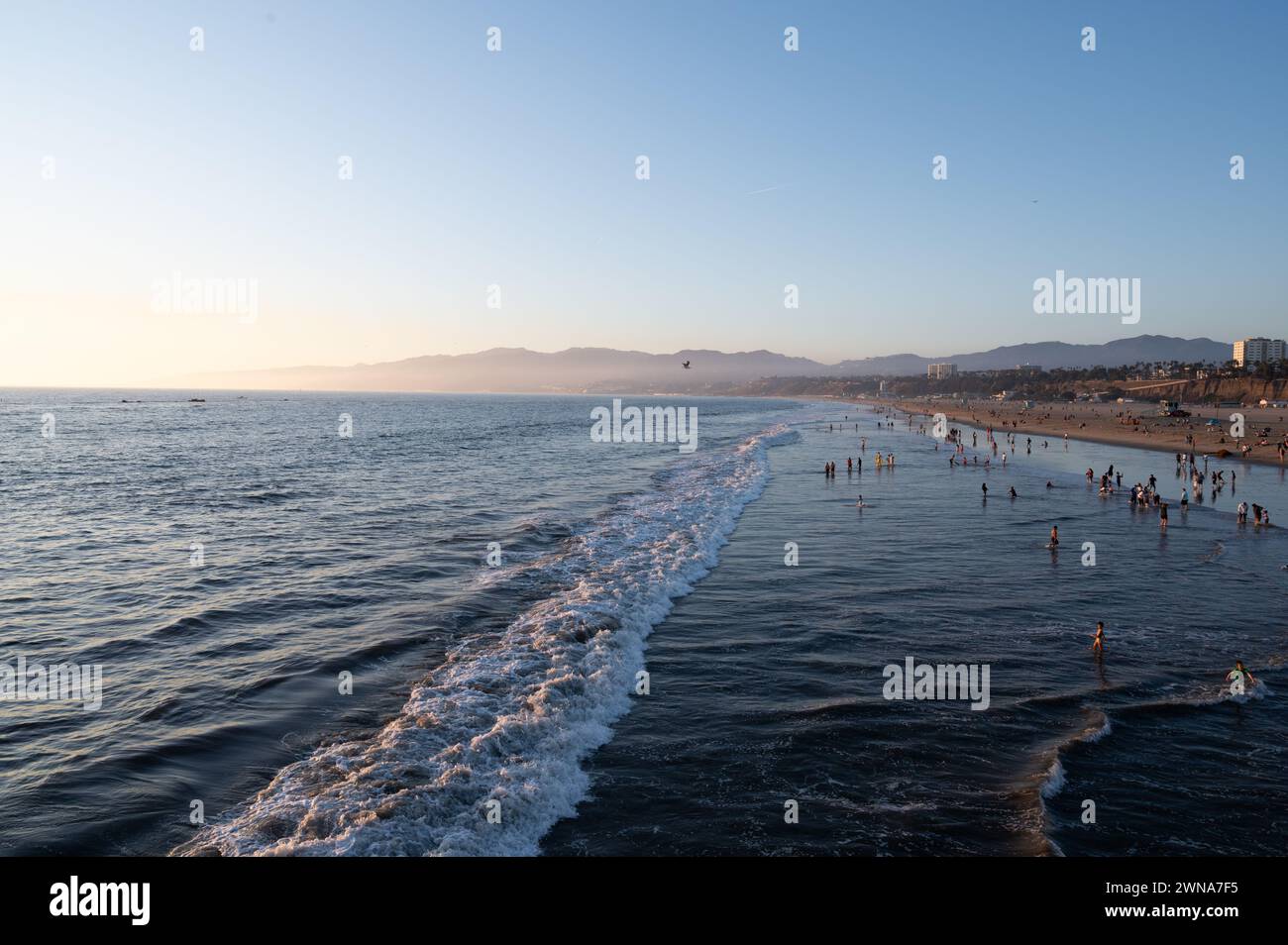 SANTA MONICA, CALIFORNIA, USA: People flock to the beach next to the world famous Santa Monica Pier in Santa Monica, California. Stock Photo