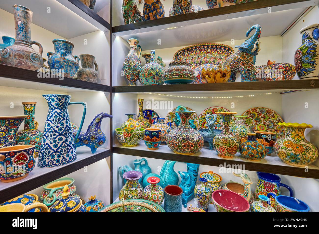 A selection of traditional handmade pottery and ceramics displayed in a gift shop in the historical Fahadan Neighborhood of Yazd, Iran. Stock Photo