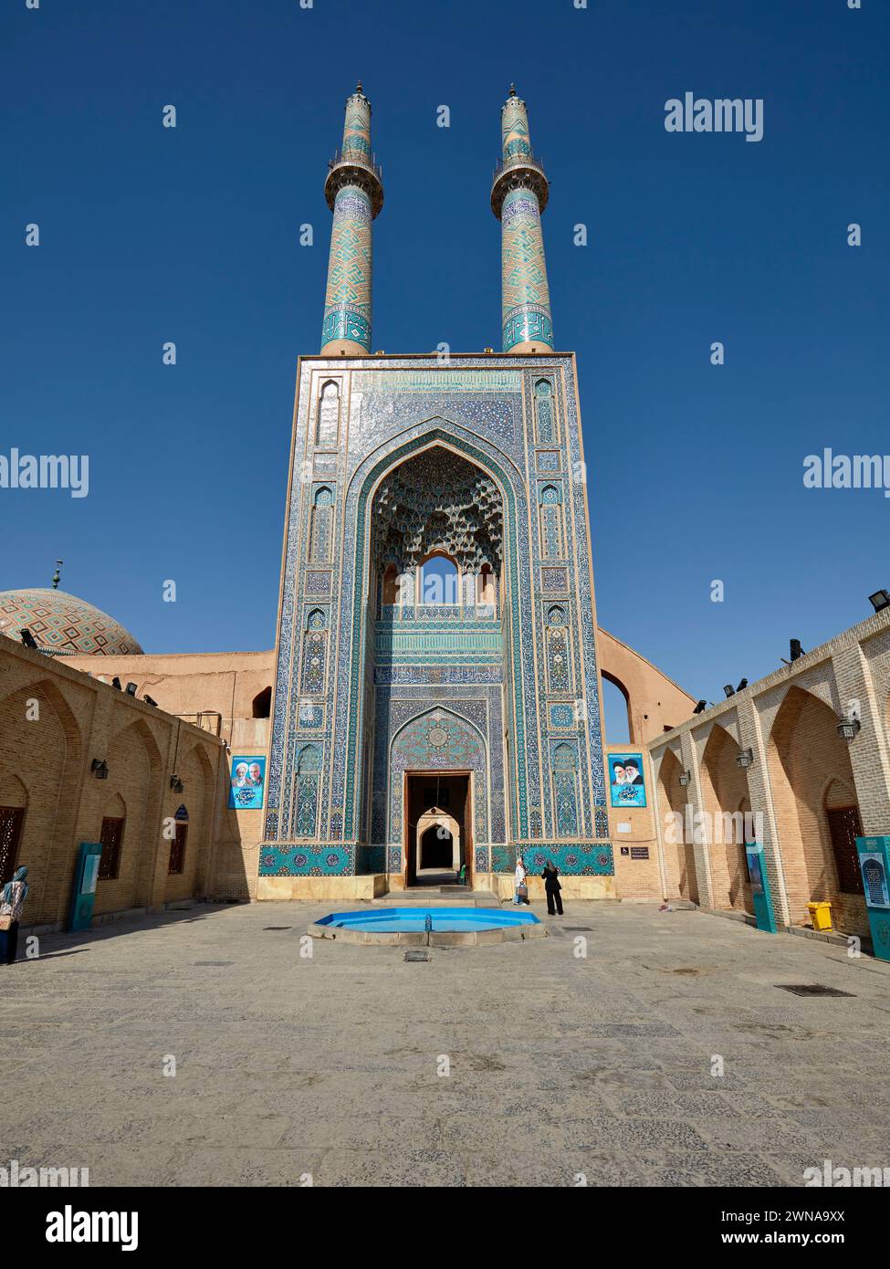 Two minarets of the Jameh Mosque of Yazd, 14th-century Azeri-style Shia mosque in the Old Town of Yazd, Iran. Stock Photo