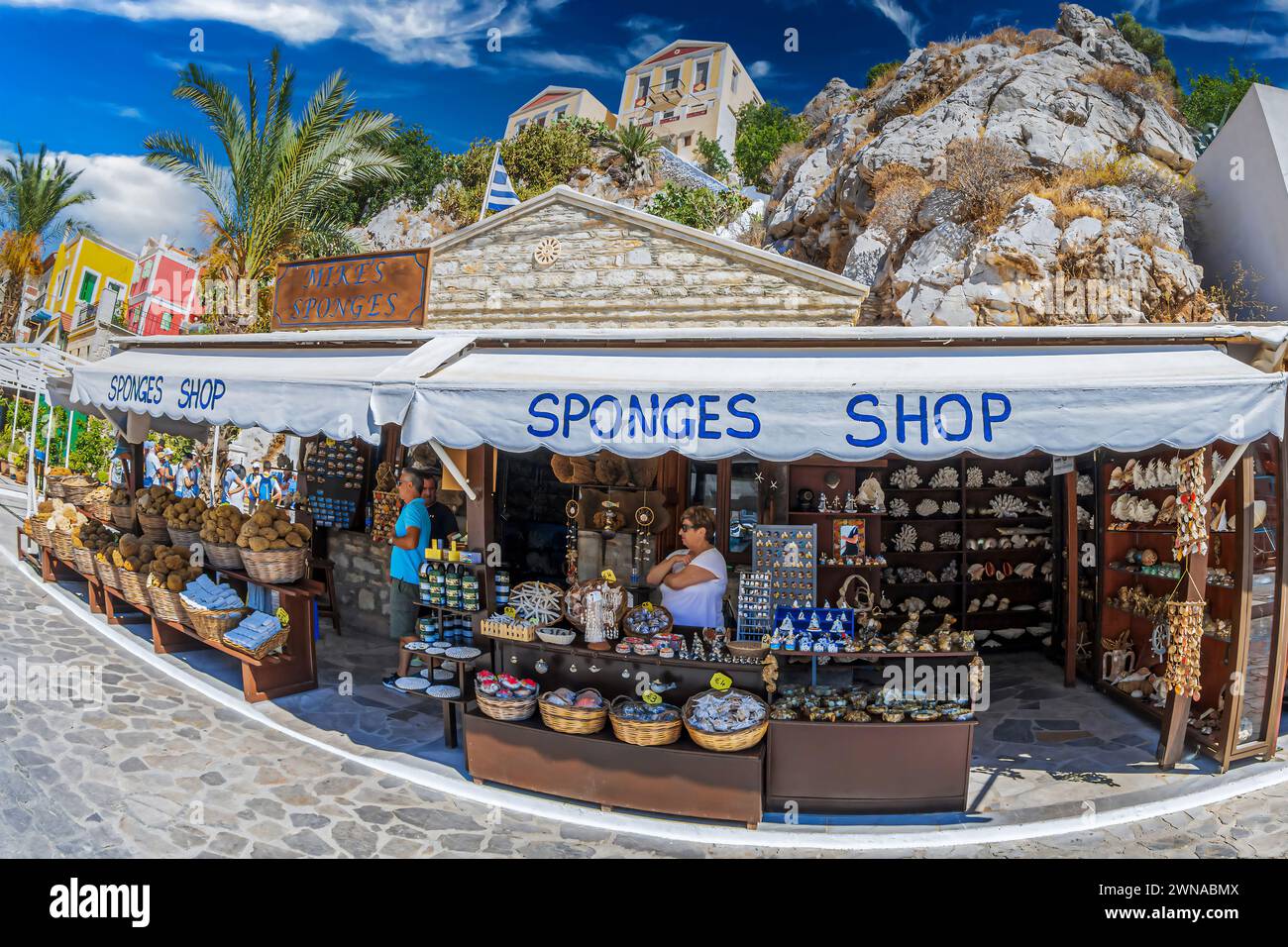 SYMI, GREECE - JULY 3, 2022: Sponge and souvenirs shop. The island is famous for medicinal sponges brought from the deep. Stock Photo