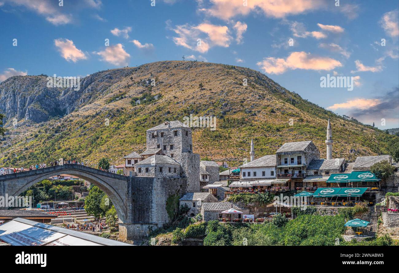 MOSTAR, BOSNIA-HERZEGOVINA - AUGUST 15, 2022: Stari Most, known as Mostar Bridge, is a rebuilt 16th-century Ottoman bridge that crosses the river Nere Stock Photo