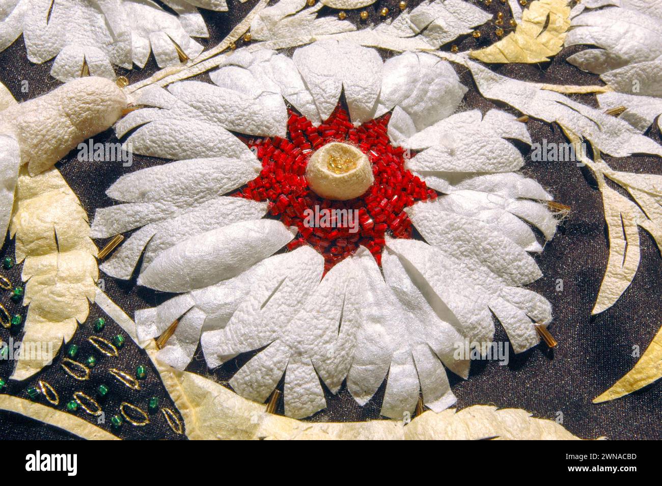Cutting filigree ornaments from the cocoons of silkworms is a tradition in Cyprus. Stock Photo