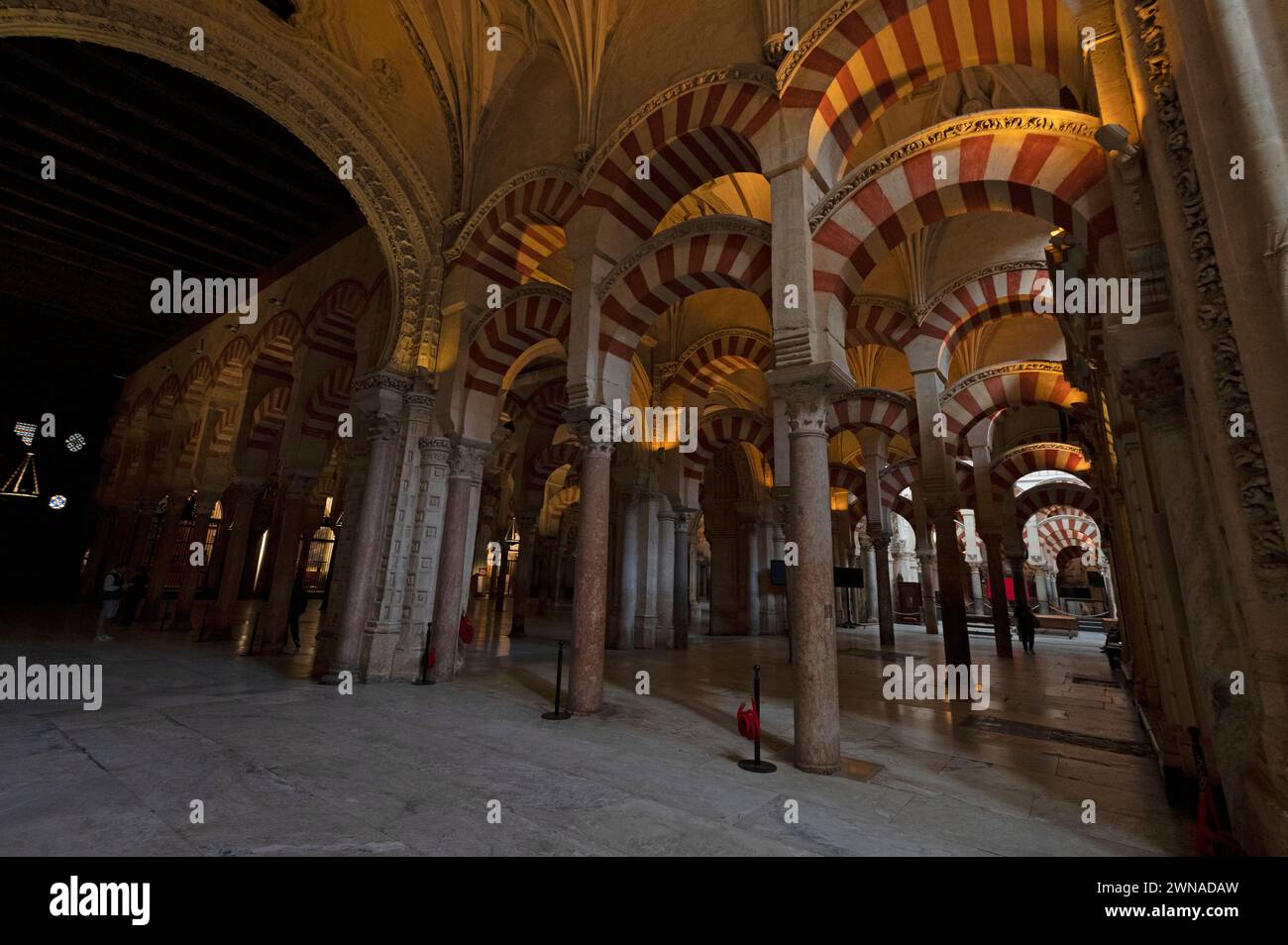 Mosque/ Cathedral of Cordoba  Interior and high ceilings supporting a huge roof by 853 thick marble columns and semi-circle made arches produced of ja Stock Photo