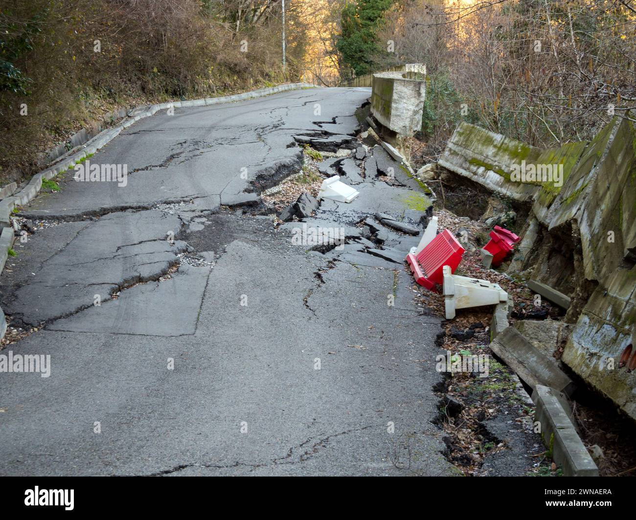 Road destroyed by a landslide in the mountains Stock Photo - Alamy