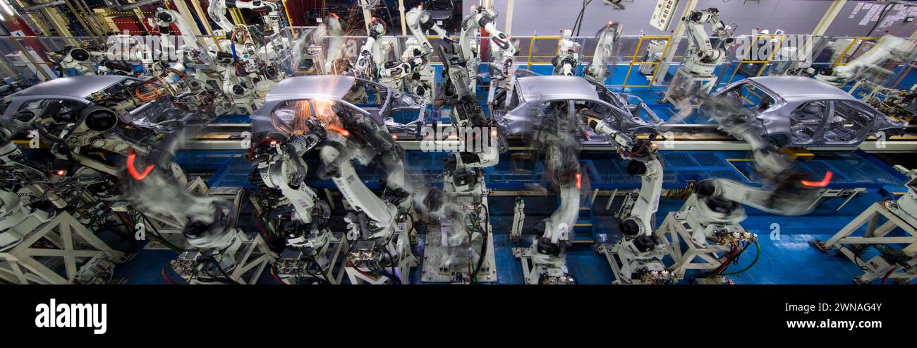 Sparks fly as robots weld Toyota Corolla bodyshells at Toyota's Burnaston factory near Derby, UK. Stock Photo