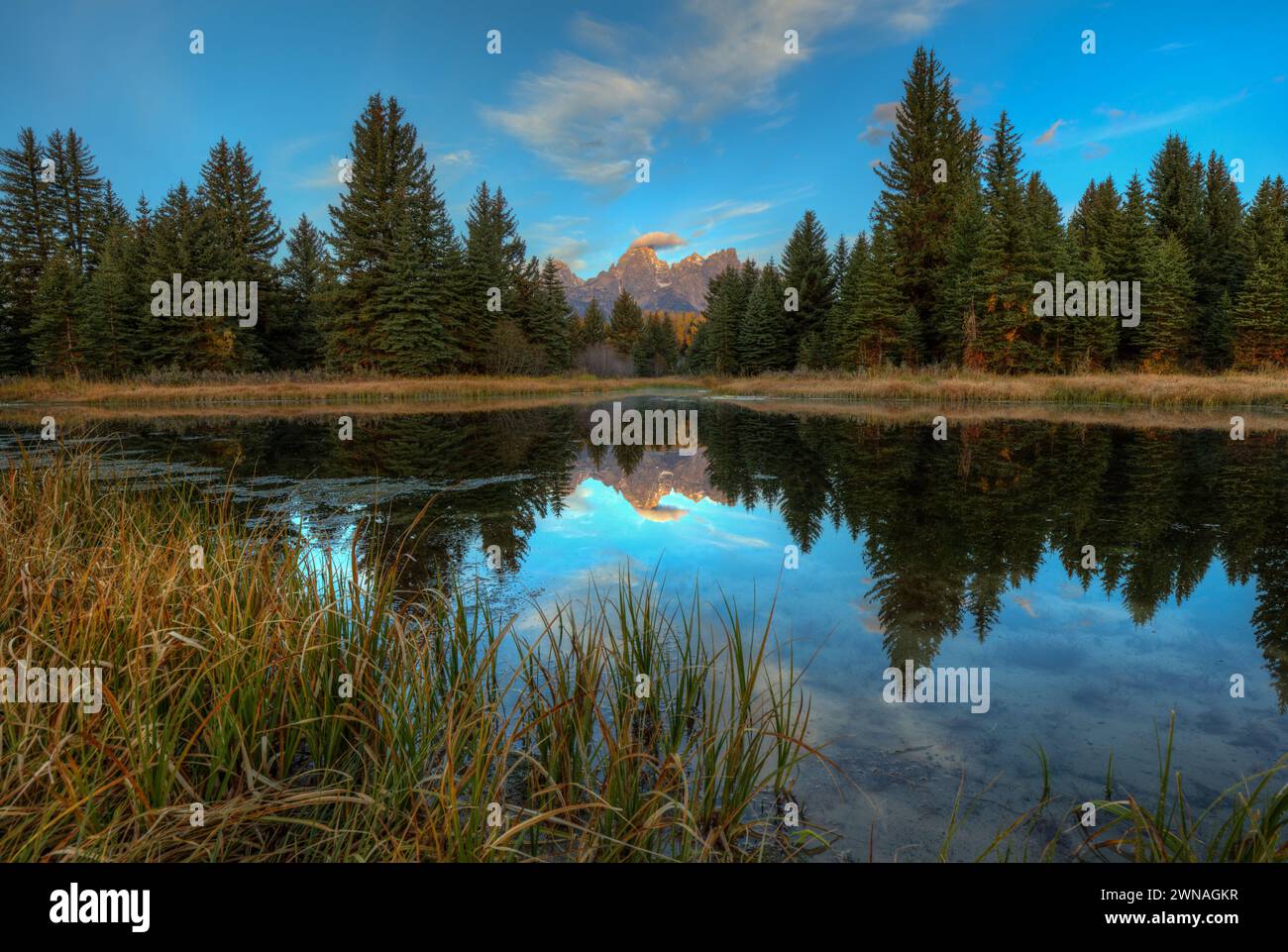 First Rays Over The Grand Tetons Stock Photo - Alamy