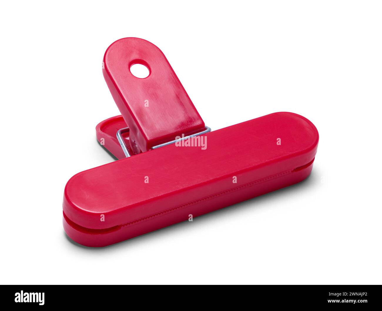 Red Chip Clamp Cut Out on White. Stock Photo