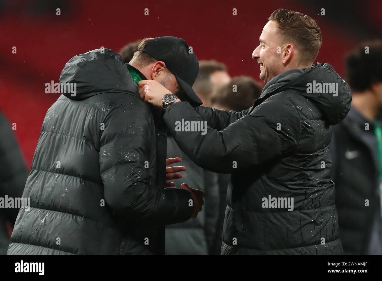 Assistant Manager of Liverpool Pep Lijnders places a winners medal over Manager of Liverpool, Jurgen Klopp - Chelsea v Liverpool, Carabao Cup Final, Wembley Stadium, London, UK - 25th February 2024 Editorial Use Only - DataCo restrictions apply Stock Photo