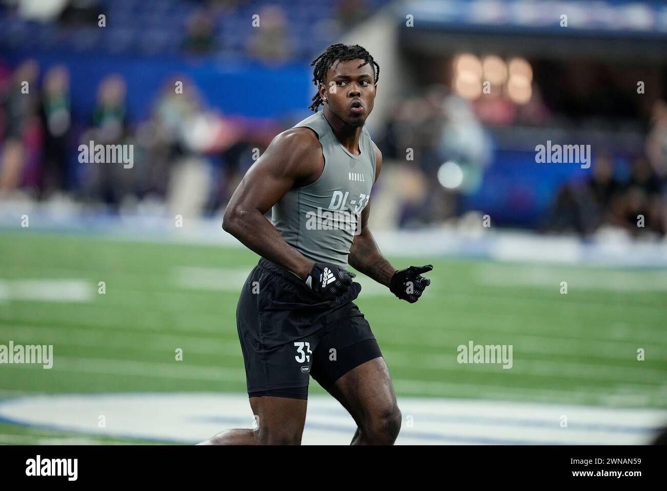 Michigan defensive lineman Jaylen Harrell runs a drill at the NFL