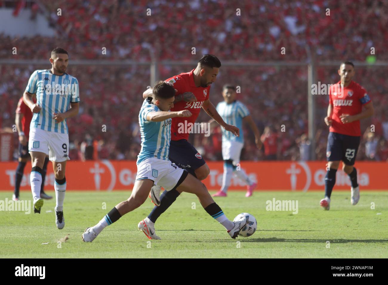 Avellaneda, Argentina, 24, February, 2024. Mauricio Isla and Gabriel Rojas dispute the ball during the match between Independiente vs Racing Club. Stock Photo
