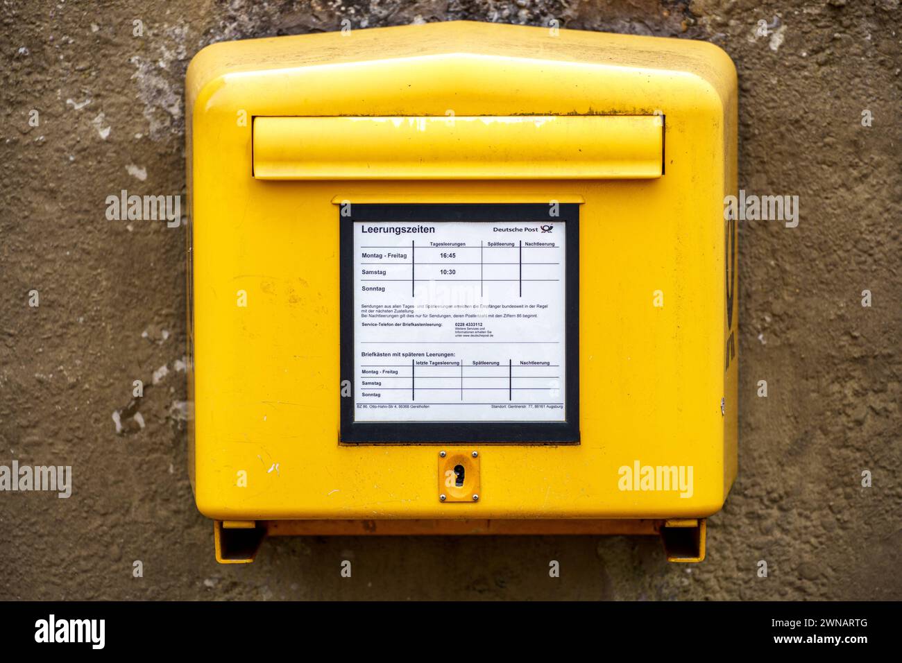 Augsburg, Bavaria, Germany - March 1, 2024: Deutsche Post public mailbox *** Öffentlicher Briefkasten der Deutschen Post Stock Photo