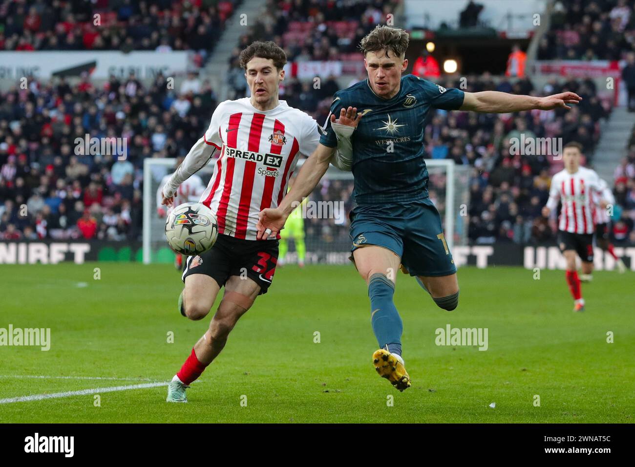 Trai Hume of Sunderland and Przemyslaw Placheta of Swansea City ...