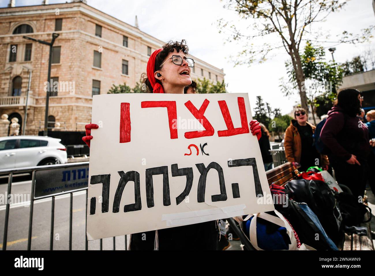 Jerusalem, Israel. 01st Mar, 2024. An activist seen holding a placard expressing her opinion during the demonstration. Israeli anti-war activists staged a demonstration at West Jerusalem's Paris Square near Israeli Prime Minister Benjamin Netanyahu's residence; calling for an end to Israel's escalating attacks in Gaza amid a deepening humanitarian catastrophe. Israeli police intervened in the demonstration and confiscated some placards and banners as some of the protesters confronted officers. Credit: SOPA Images Limited/Alamy Live News Stock Photo