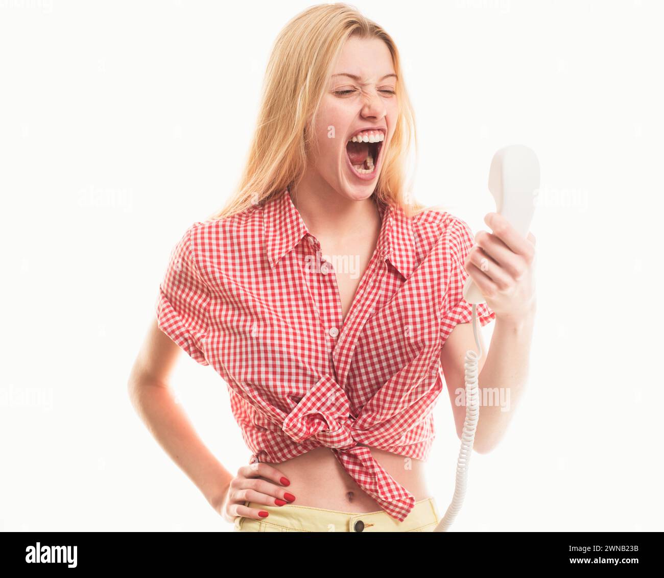 Screaming Call Angry sad blonde woman holding telephone tube. Phone call. Woman ...