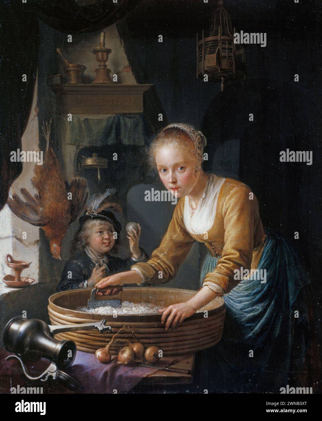 GERRIT DOU (LEIDEN 1613-LEIDEN 1675) A Girl chopping Onions Signed and dated 1646 Stock Photo
