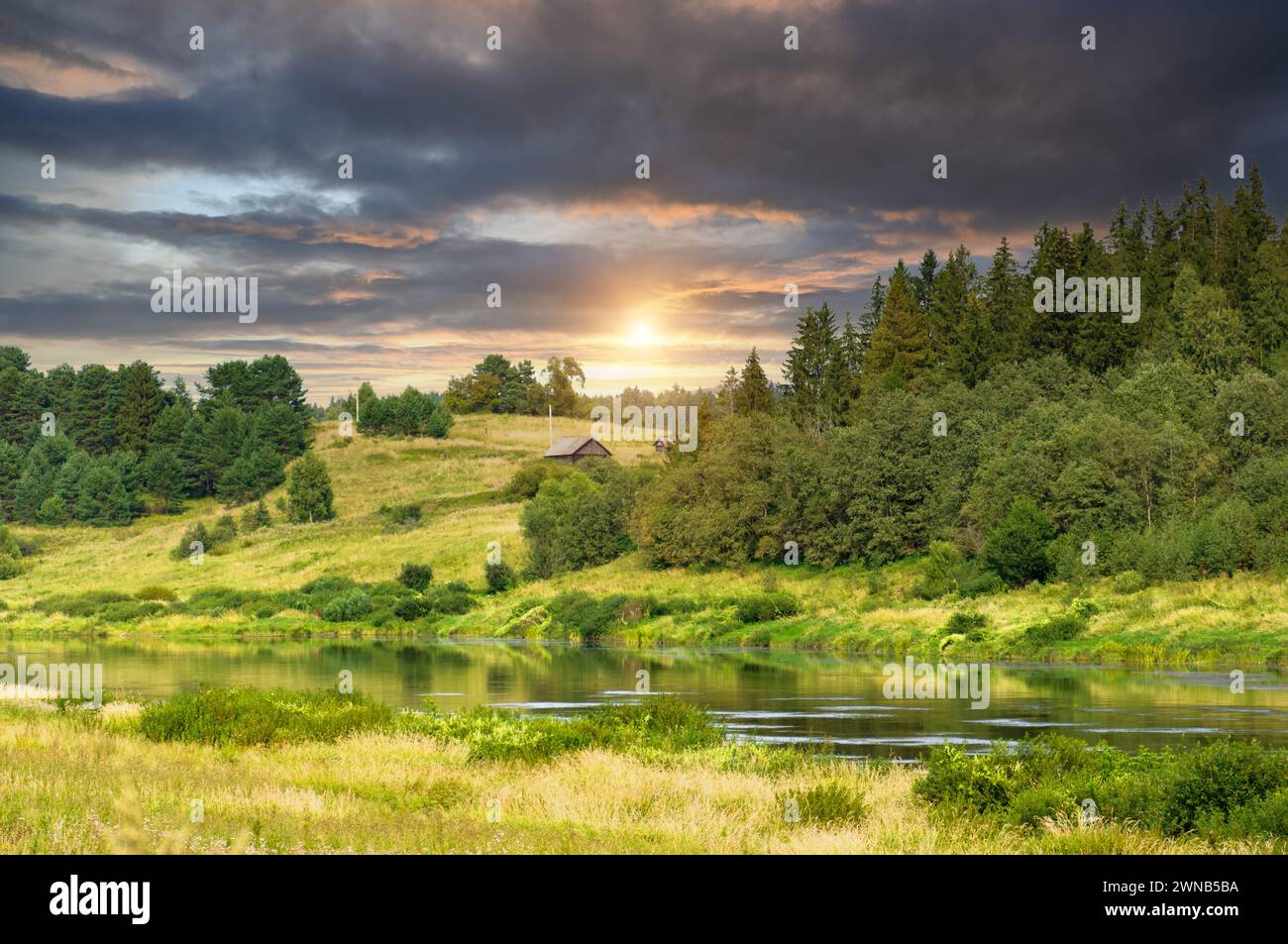 Europe, Russia, Tver region. Wooded bank of the Volga river. The upper reaches of the Volga river on a summer day. Stock Photo