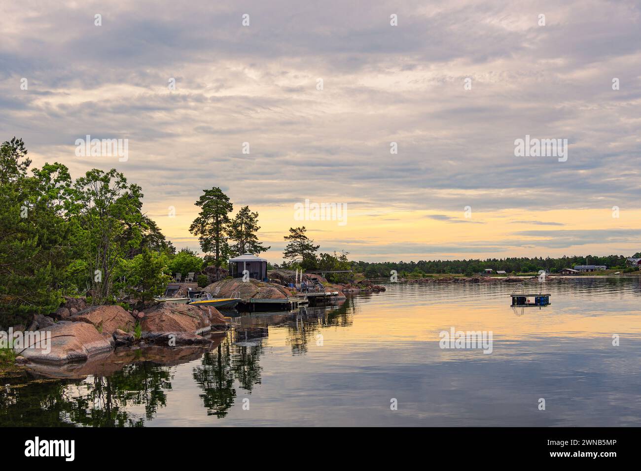 Baltic Sea coast with rocks and trees near Oskarshamn in Sweden. Stock Photo