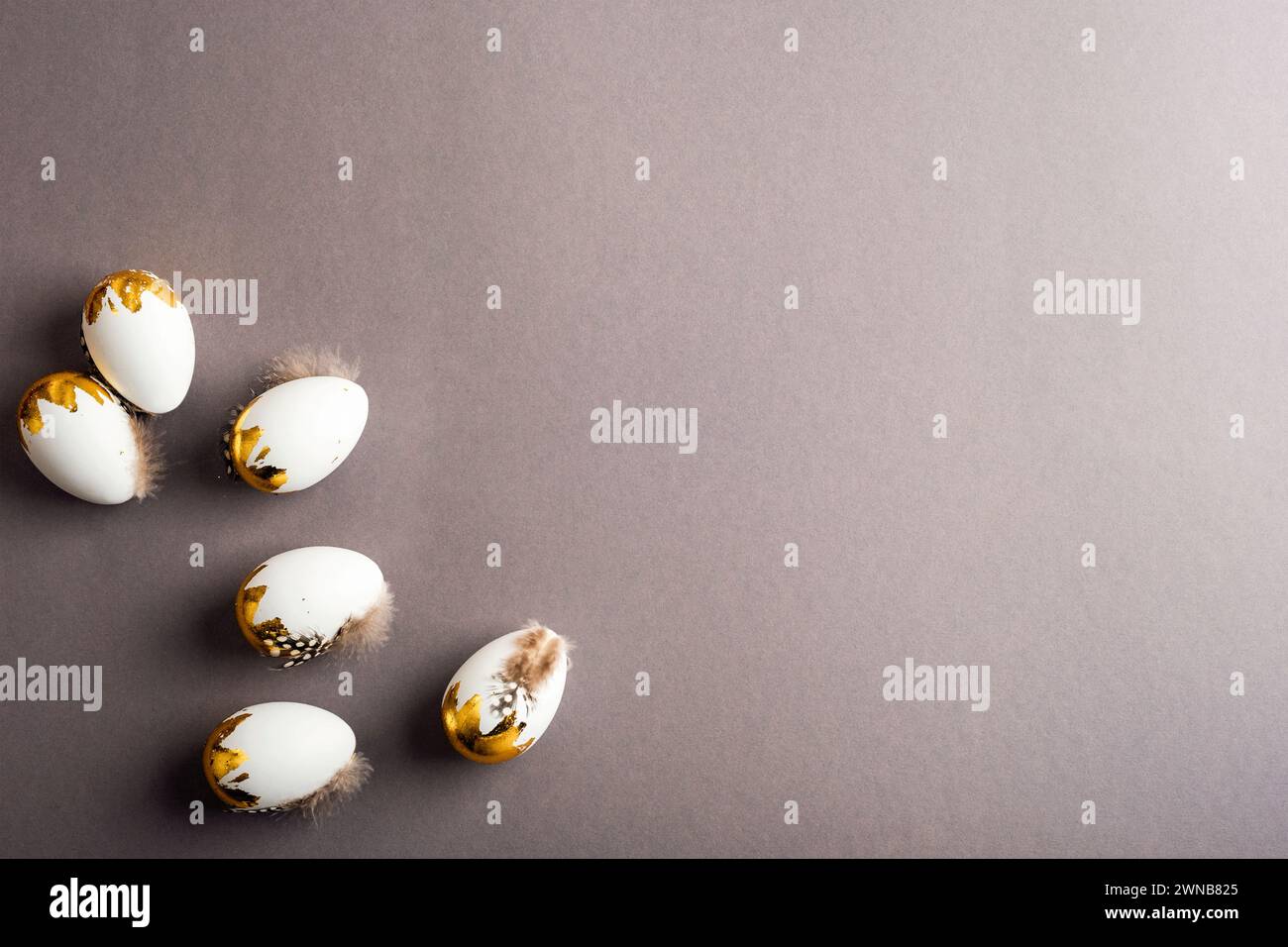 Easter eggs on dark gray background. Easter concept. Top view, flat lay, copy space. Stock Photo