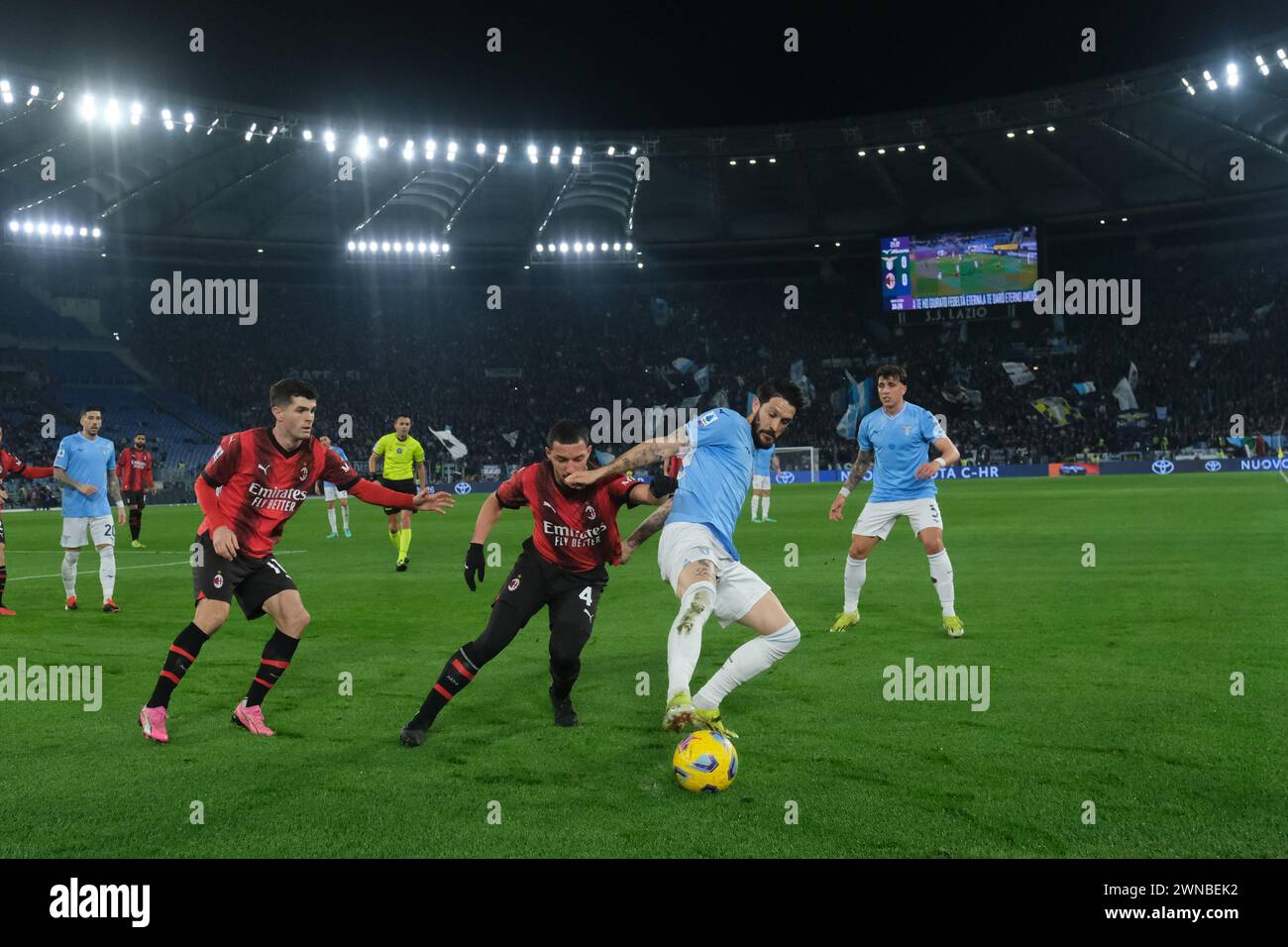 Rome, Italy. 01st Mar, 2024. Lazioâ&#x80;&#x99;s Spanish midfielder Luis Alberto challenges for the ball with Milan's Algerian midfielder Ismael Bennacer during the Serie A football match SS Lazio vs AC Milan at Olimpico Stadium on March 01, 2024, in Rome. Credit: Independent Photo Agency/Alamy Live News Stock Photo