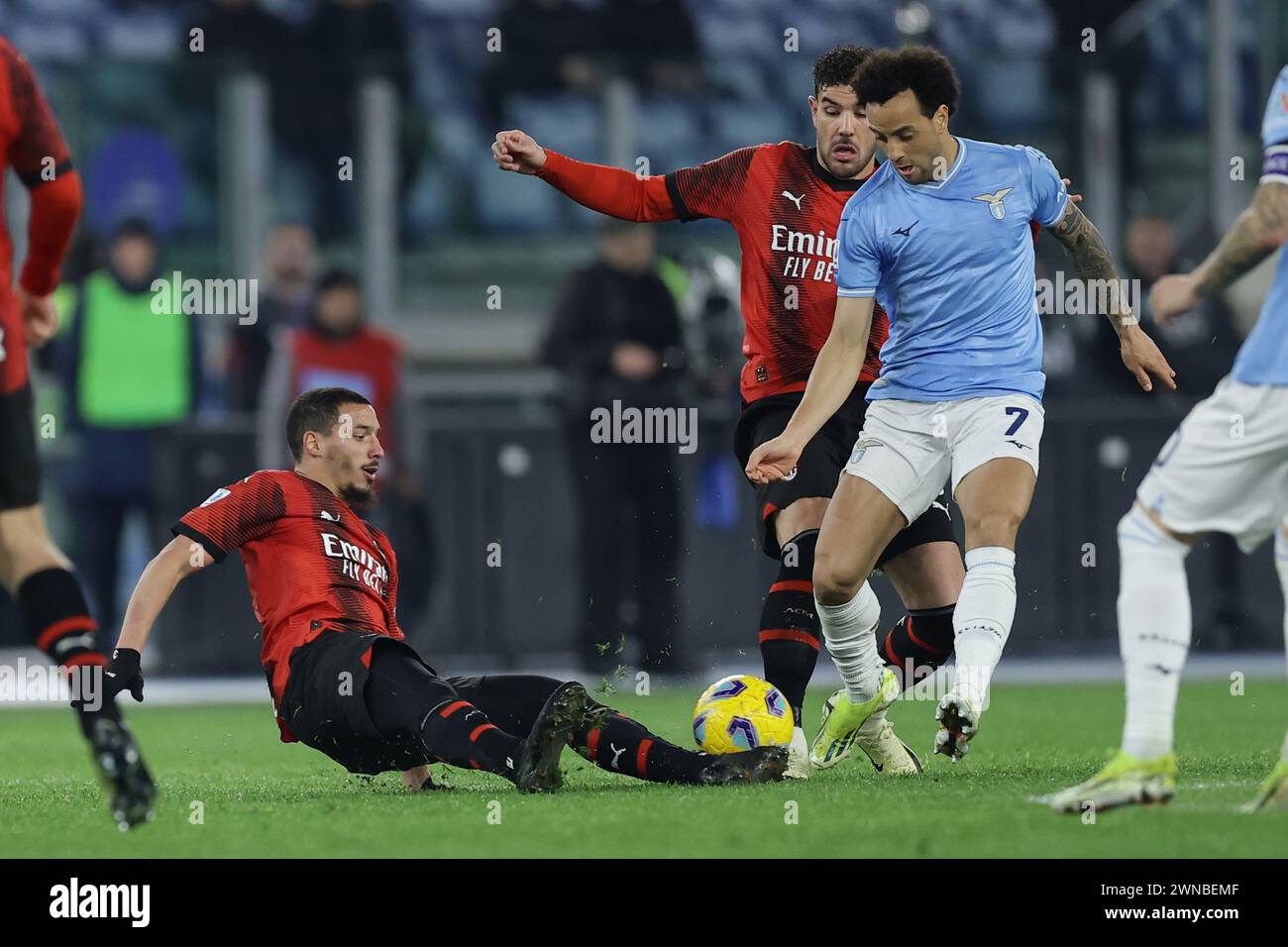 Rome, Italy. 01st Mar, 2024. Milan's Algerian midfielder Ismael Bennacer challenges for the ball with Lazio's Brazilian forward Felipe Anderson during the Serie A football match SS Lazio vs AC Milan at Olimpico Stadium on March 01, 2024, in Rome. Credit: Independent Photo Agency/Alamy Live News Stock Photo