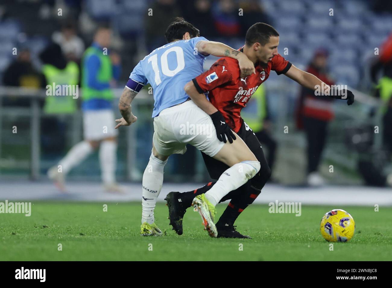 Rome, Italy. 01st Mar, 2024. Lazioâ&#x80;&#x99;s Spanish midfielder Luis Alberto challenges for the ball with Milan's Algerian midfielder Ismael Bennacer during the Serie A football match SS Lazio vs AC Milan at Olimpico Stadium on March 01, 2024, in Rome. Credit: Independent Photo Agency/Alamy Live News Stock Photo