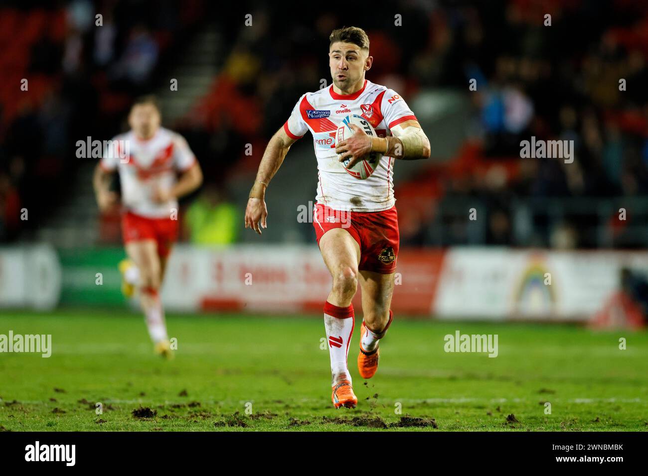 St Helens' Tommy Makinson on their way to scoring their side's second try of the game during the Betfred Super League match at the Totally Wicked Stadium, St Helens. Picture date: Friday March 1, 2024. Stock Photo