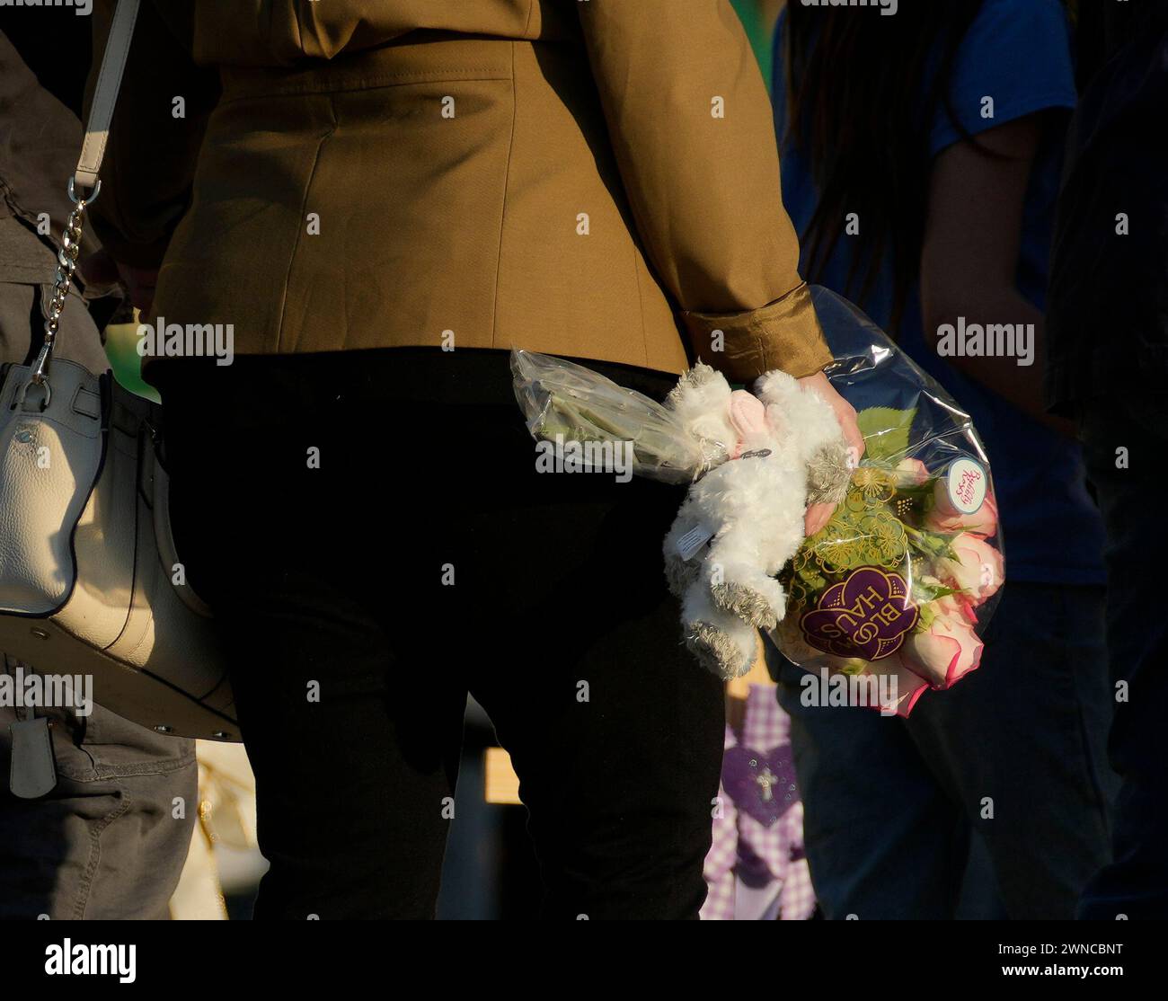 People bring flowers to pay respect to Audrii Cunningham during public