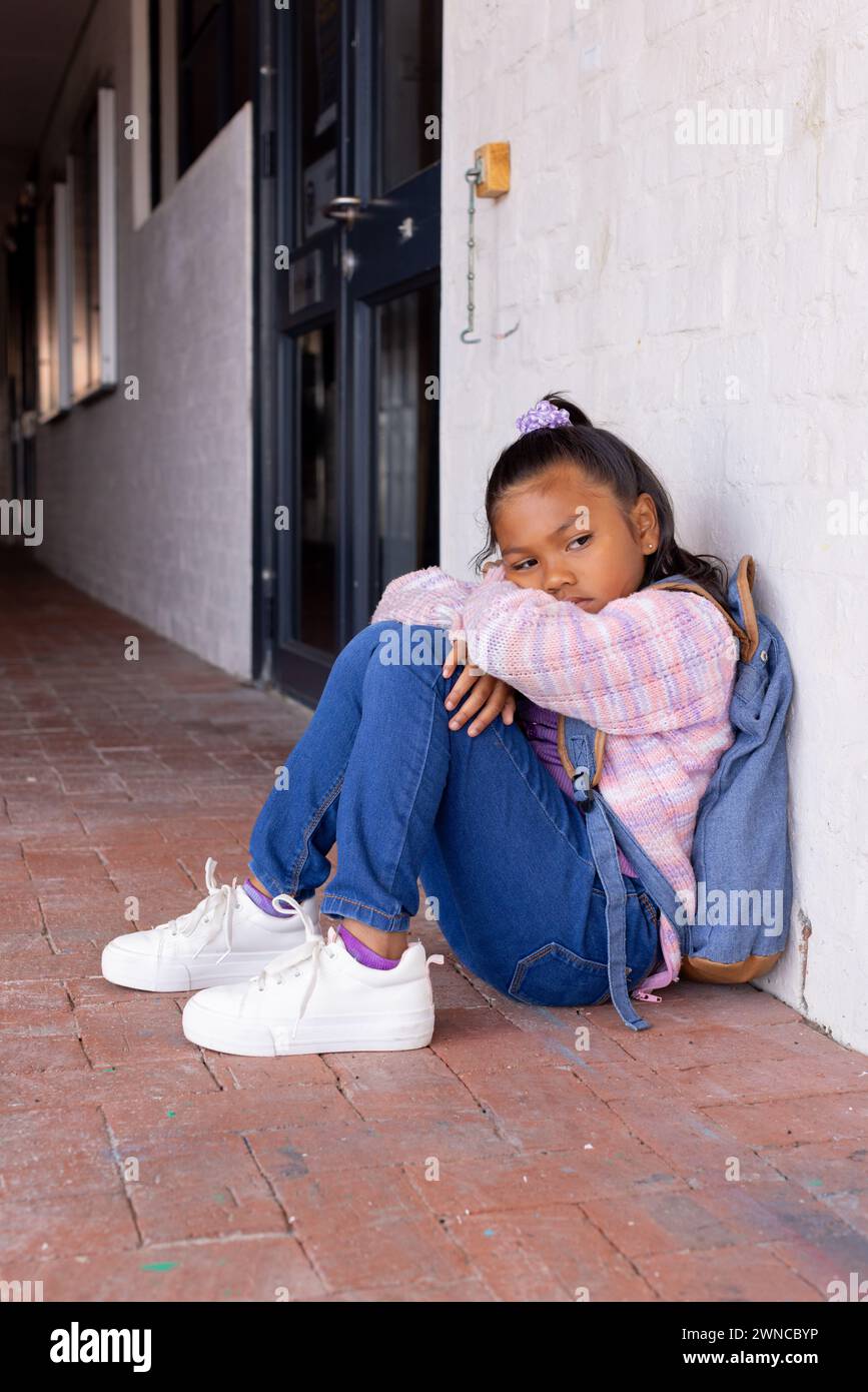 Girl hugging knees hi-res stock photography and images - Alamy