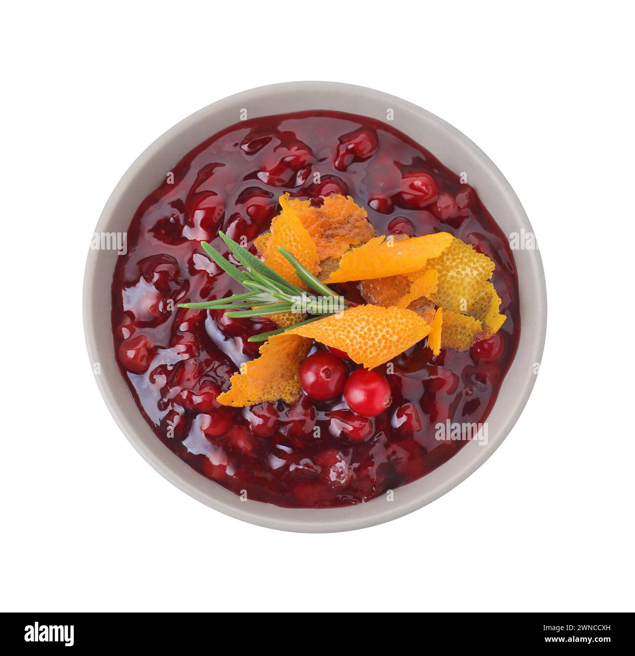 Fresh cranberry sauce, rosemary and orange peel in bowl isolated on ...