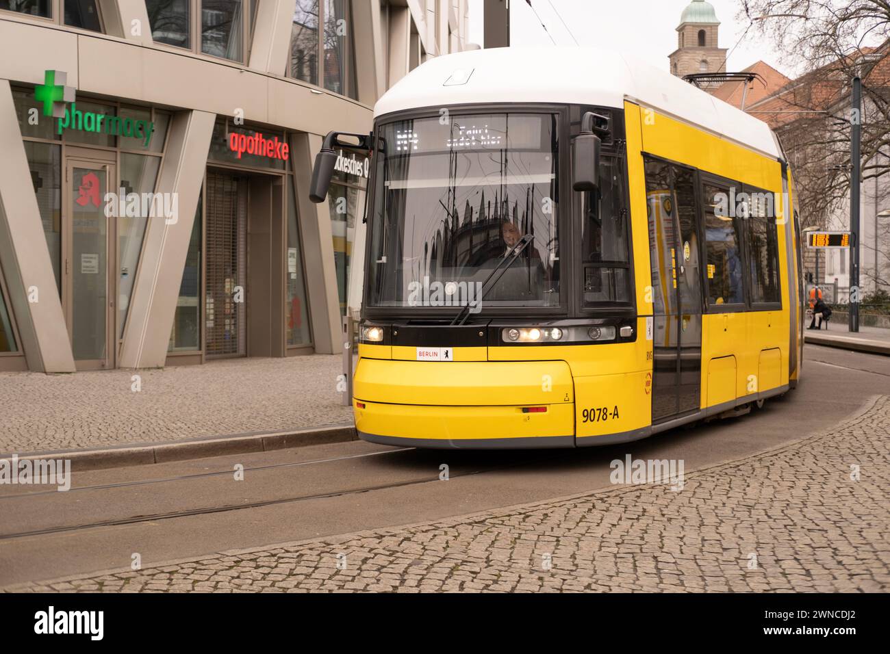 yellow tram Generation Flexity Berlin driving down city street in Berlin, travel, tourism and city breaks, eco-friendly public transportation system, Stock Photo
