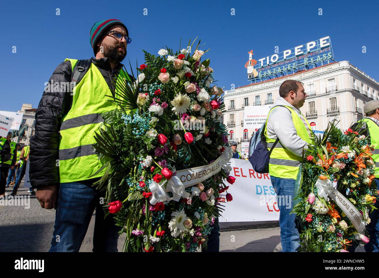 Madrid, Spain. 01st Mar, 2024. A rancher carries a funeral wreath during a demonstration in Madrid's Puerta del Sol square. A group of Galician ranchers gathered during the morning in the center of Madrid with a coffin and funeral wreaths to represent the 'Death of the Galician countryside' (Photo by David Canales/SOPA Images/Sipa USA) Credit: Sipa USA/Alamy Live News Stock Photo