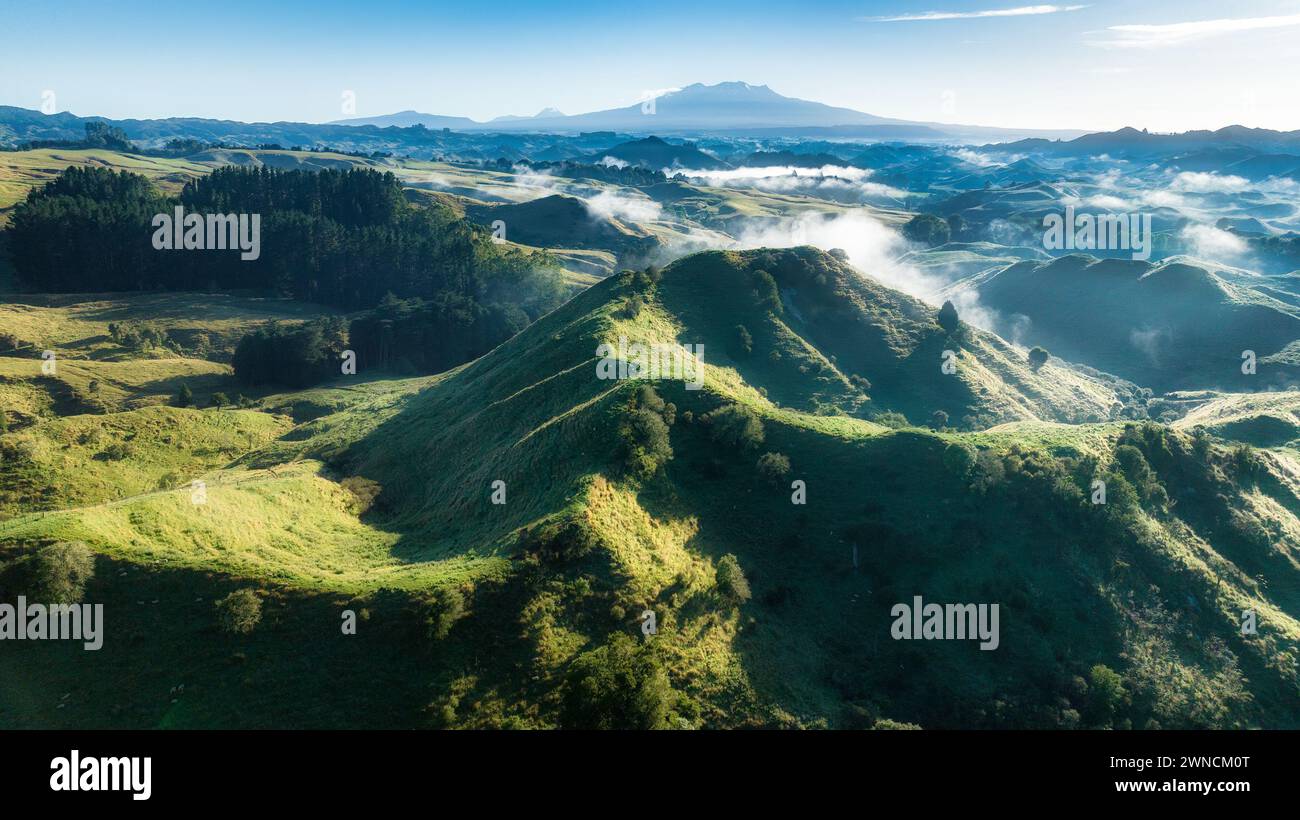 Magical mystical morning cloud in the valleys with a backdrop of the central plateau mountains captured by a drone Stock Photo