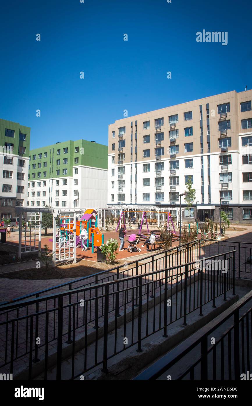 Modern apartment buildings with a courtyard playground. Contemporary ...