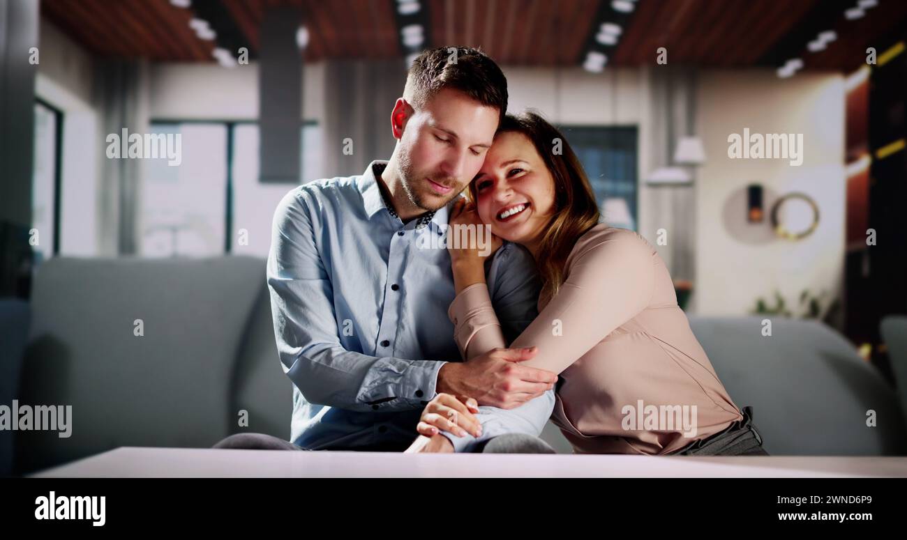 Romantic Happy Couple Relaxing On Couch At Home Stock Photo