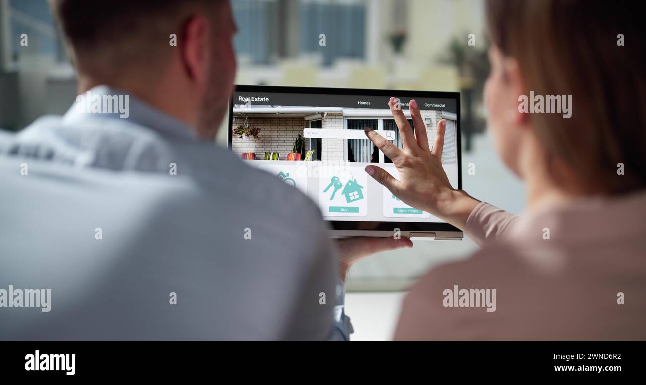 Couple Family Searching Real Estate Property Or House Online Stock Photo
