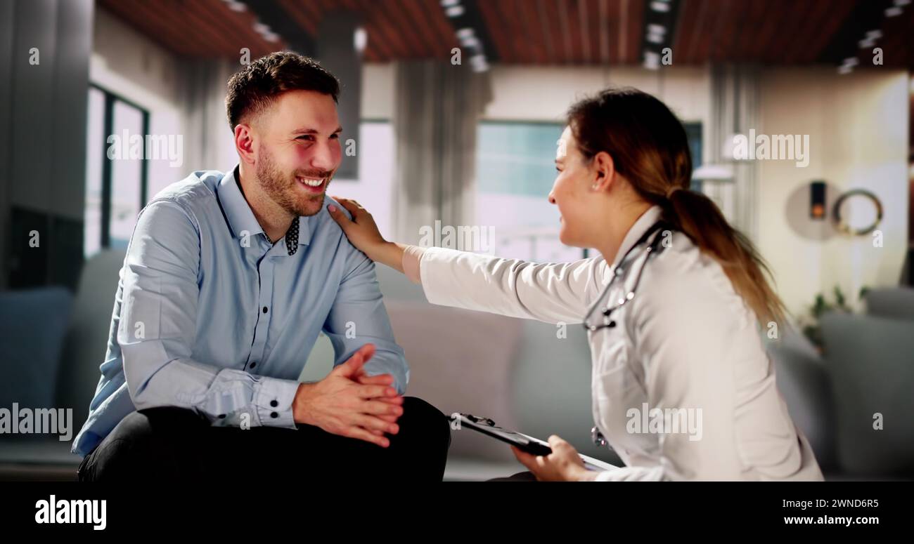 Home Care Patient Talking To His Doctor Stock Photo